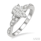 1/2 Ctw Pear Shape Center Criss Cross Carved Shank Lovebright Round Cut Diamond Engagement Ring in 14K White Gold