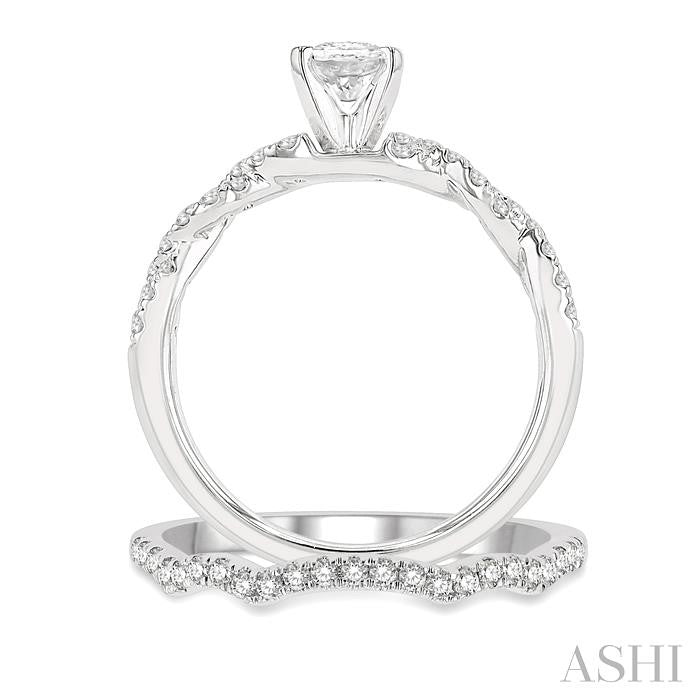 1 1/10 Ctw Diamond Wedding Set With 7/8 Ctw Twisted Shank Oval Cut Engagement Ring and 1/6 Ctw Curve Wedding Band in 14K White Gold