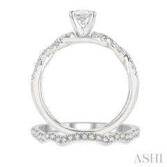 1 1/10 Ctw Diamond Wedding Set With 7/8 Ctw Twisted Shank Oval Cut Engagement Ring and 1/6 Ctw Curve Wedding Band in 14K White Gold