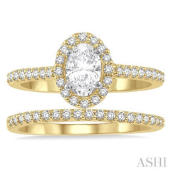 7/8 Ctw Diamond Wedding Set With 3/4 Ctw Oval Cut Engagement Ring and 1/6 Ctw Wedding Band in 14K Yellow and white gold