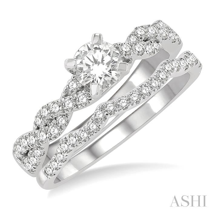 1 1/10 Ctw Diamond Wedding Set With 7/8 Ctw Twisted Shank Round Cut Engagement Ring and 1/6 Ctw Curve Wedding Band in 14K White Gold
