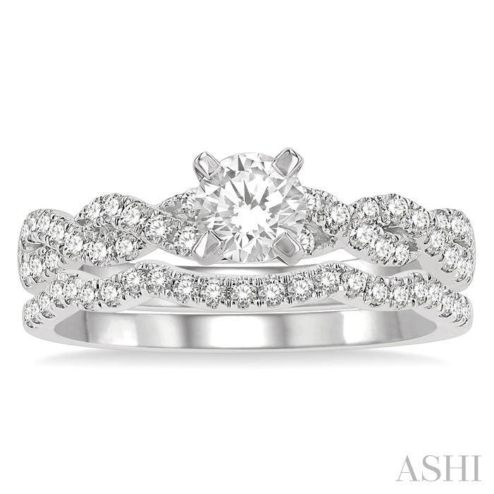 1 1/10 Ctw Diamond Wedding Set With 7/8 Ctw Twisted Shank Round Cut Engagement Ring and 1/6 Ctw Curve Wedding Band in 14K White Gold