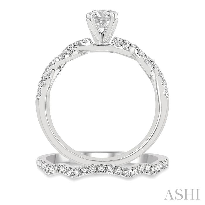 1 1/10 Ctw Diamond Wedding Set With 7/8 Ctw Twisted Shank Round Cut Engagement Ring and 1/6 Ctw Curve Wedding Band in 14K White Gold