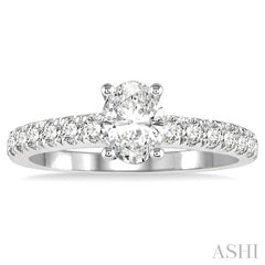 1 1/10 Ctw Oval shape Diamond Ladies Engagement Ring with 5/8 Ct Oval Cut Center Stone in 14K White Gold