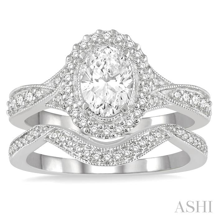 1 1/10 Ctw Free Form Shank Round Cut Diamond Bridal Set With 1 Ct Oval Cut Engagement Ring and 1/10 Ct Curved Center Wedding Band in 14K White Gold