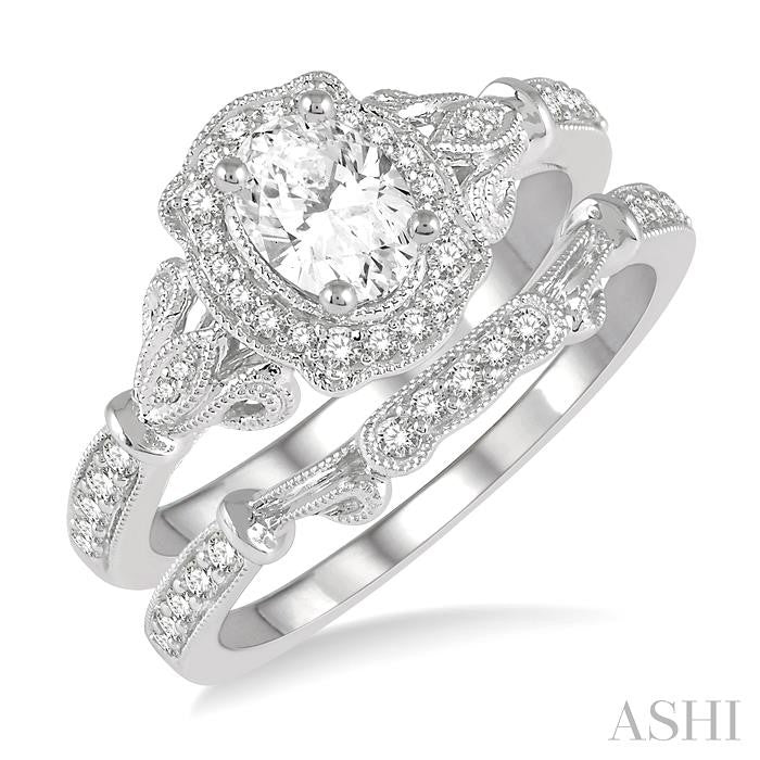 3/4 Ctw Round Cut Diamond Wedding Set With 5/8 Ctw Oval Cut Engagement Ring and 1/10 Ctw Wedding Band in 14K White Gold