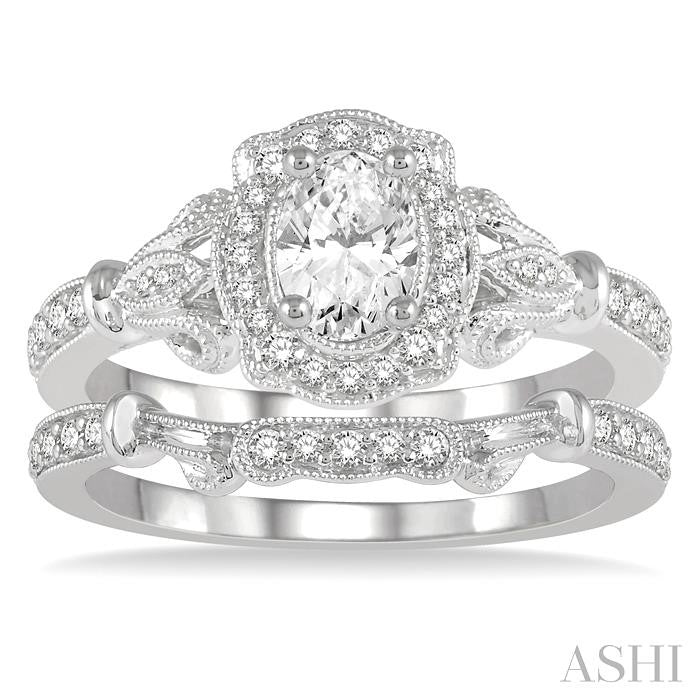 3/4 Ctw Round Cut Diamond Wedding Set With 5/8 Ctw Oval Cut Engagement Ring and 1/10 Ctw Wedding Band in 14K White Gold