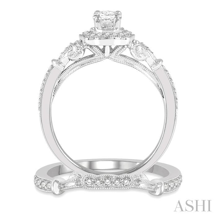 3/4 Ctw Round Cut Diamond Wedding Set With 5/8 Ctw Oval Cut Engagement Ring and 1/10 Ctw Wedding Band in 14K White Gold