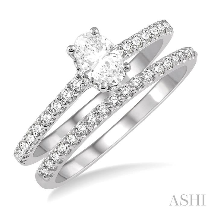 3/4 Ctw Diamond Wedding Set With 5/8 Ct Oval Shape Diamond Engagement Ring and 1/6 Ct Wedding Band in 14K White Gold