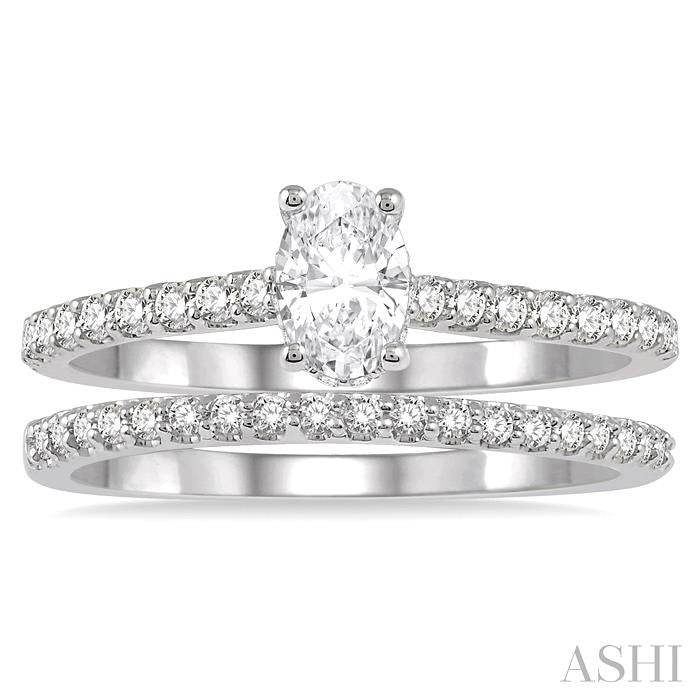 3/4 Ctw Diamond Wedding Set With 5/8 Ct Oval Shape Diamond Engagement Ring and 1/6 Ct Wedding Band in 14K White Gold