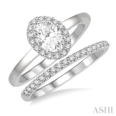 3/4 Ctw Round Cut Diamond Wedding Set With 5/8 Ct Oval Cut Engagement Ring and 1/6 Ct Round Cut Diamond Wedding Band in 14K White Gold