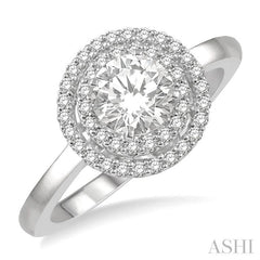 3/4 Ctw Round Cut Diamond Ladies Engagement Ring with 1/2 Ctw Round Cut Center Stone in 14K White Gold