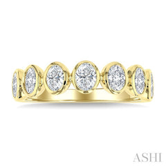 1 1/4 Ctw 7 Stone Bezel Set Oval Cut Diamond Fashion Band in 14K Yellow Gold
