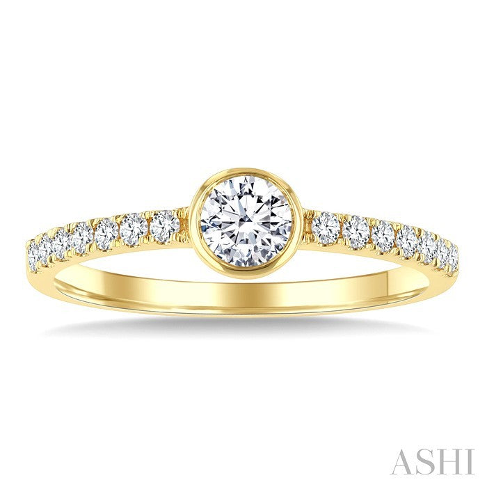 1/2 Ctw Bezel Set Round Cut Diamond Ring in 14K Yellow Gold