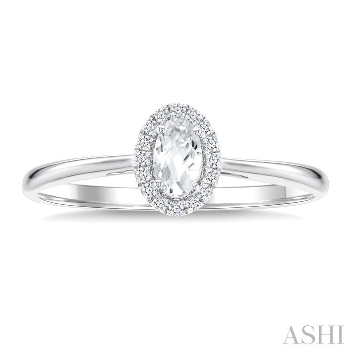 5x3 MM Oval Shape White Topaz and 1/20 Ctw Round Cut Diamond Halo Semi-Precious Ring in 14K White Gold