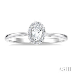 5x3 MM Oval Shape White Topaz and 1/20 Ctw Round Cut Diamond Halo Semi-Precious Ring in 14K White Gold