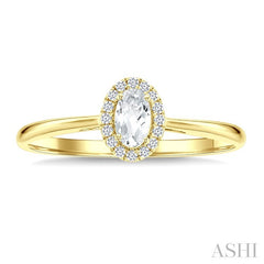 5x3 MM Oval Shape White Topaz and 1/20 Ctw Round Cut Diamond Halo Semi-Precious Ring in 14K Yellow Gold