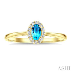 5x3 MM Oval Shape Blue Topaz and 1/20 Ctw Round Cut Diamond Halo Semi-Precious Ring in 10K Yellow Gold