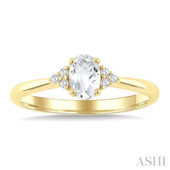 1/20 Ctw Oval Cut 6X4 MM White Topaz and Round Cut Diamond semi-precious Ring in 10K Yellow Gold
