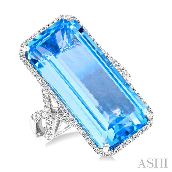 26x12 MM Emerald Cut Blue Topaz and 1/2 Ctw Round Cut Diamond Halo Semi-Precious Ring in 14K White Gold