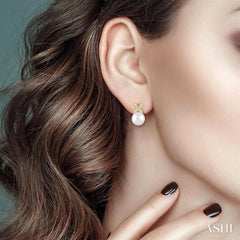 5.5 MM Round Shape Cultured Pearls and 1/20 Ctw Petite 4-Petal Flower Round Cut Diamond Fashion Stud Earring in 10K Yellow Gold