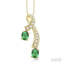 5x4 MM Oval Cut Emerald and 1/6 Ctw Round Cut Diamond Precious Pendant in 14K Yellow Gold with Chain