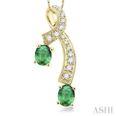 5x4 MM Oval Cut Emerald and 1/6 Ctw Round Cut Diamond Precious Pendant in 14K Yellow Gold with Chain