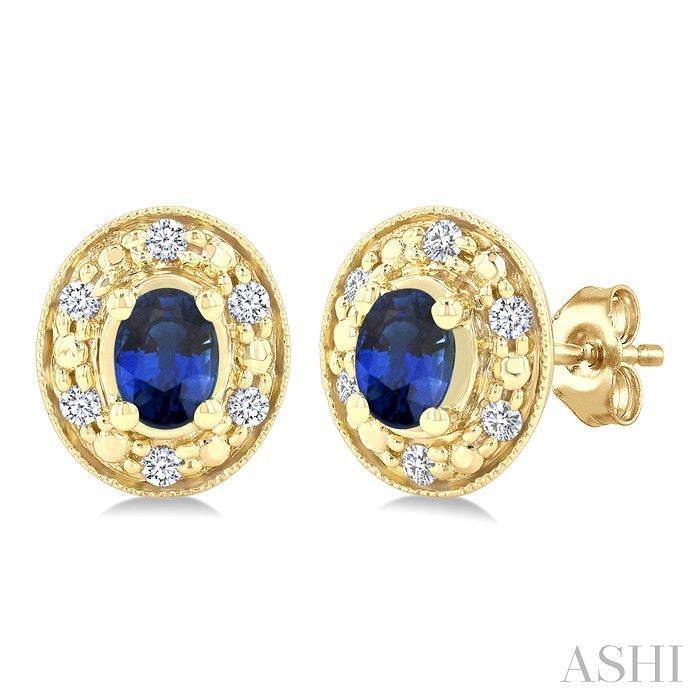 4x3 MM Oval Shaped Sapphire and 1/10 Ctw Round Cut Diamond Earrings in 14K Yellow Gold