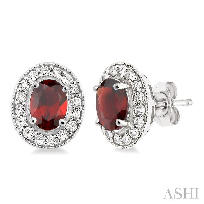 7x5 MM Oval Cut Garnet and 3/8 Ctw Round Cut Diamond Earrings in 14K White Gold