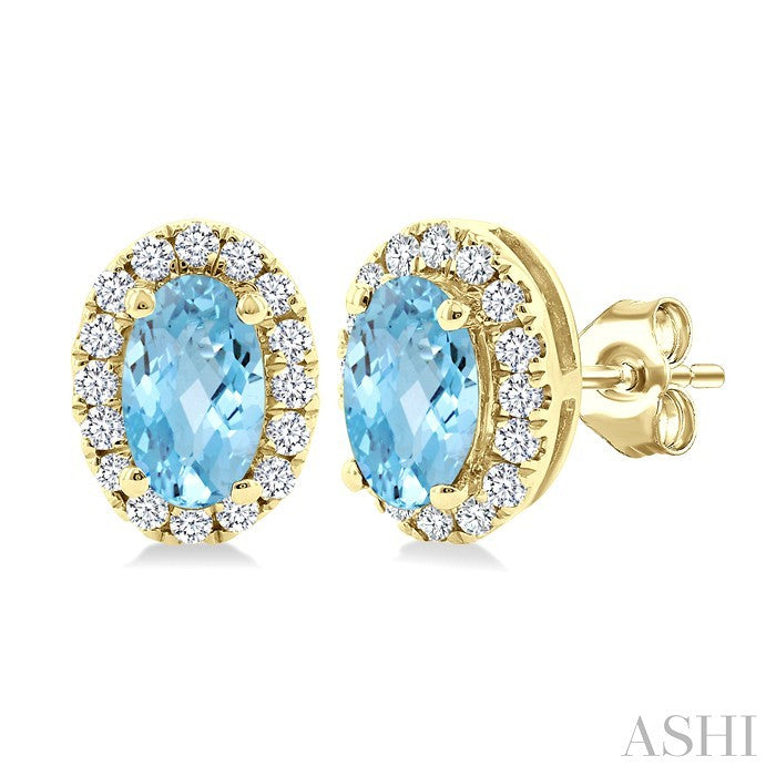 5x3 MM Oval Shape Aquamarine and 1/8 Ctw Round Cut Diamond Halo Semi-Precious Stud Earrings in 14K Yellow Gold