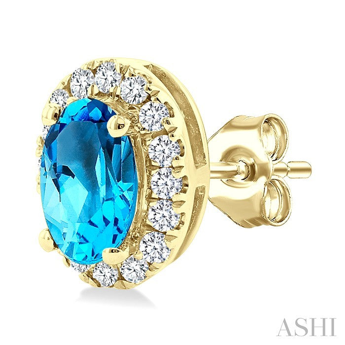 5x3 MM Oval Shape Blue Topaz and 1/8 Ctw Round Cut Diamond Halo Semi-Precious Stud Earrings in 14K Yellow Gold