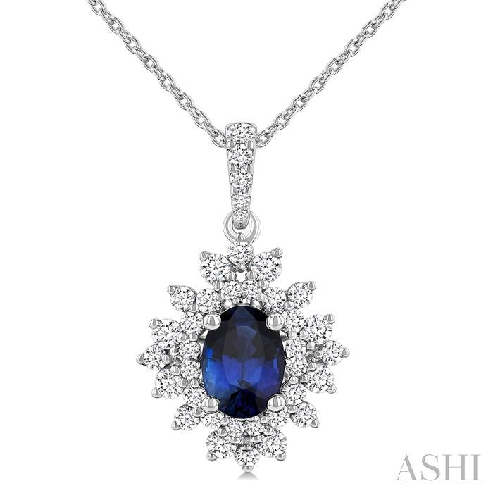 7x5 MM Oval Cut Sapphire and 1/2 Ctw Round Cut Diamond Halo Precious Pendant With Chain in 14K White Gold