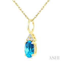 1/50 Ctw Oval Cut 6X4 MM Blue Topaz and Round Cut Diamond semi-precious Pendant With Chain in 10K Yellow Gold