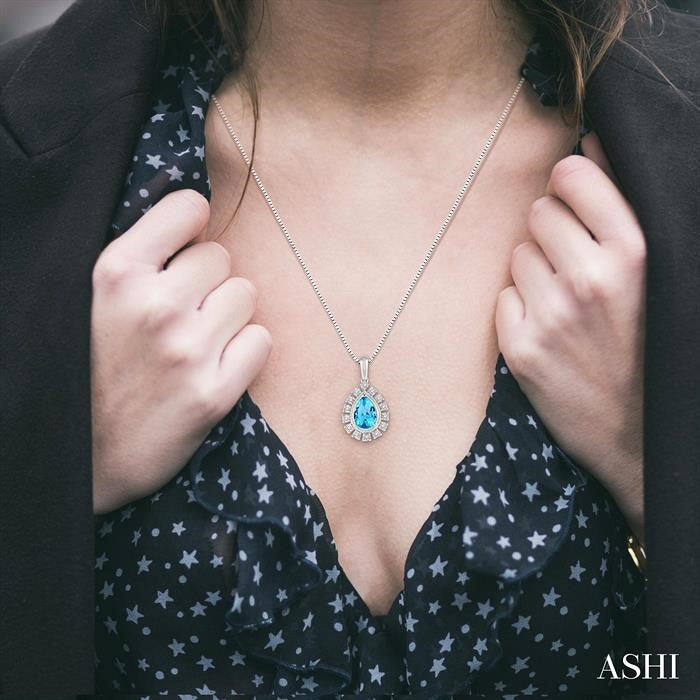 9x6 MM Pear Shape Blue Topaz and 1/10 Ctw Round Cut Diamond Semi-Precious Pendant With Chain in 10K White Gold