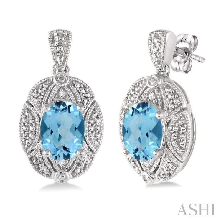 8x6 MM Oval Cut Blue Topaz and 1/50 Ctw Round Cut Diamond Earrings in Sterling Silver