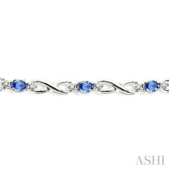 4x3mm Oval Cut Tanzanite and 1/10 Ctw Round Cut Diamond Bracelet in 10K White Gold