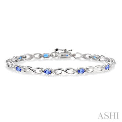 4x3mm Oval Cut Tanzanite and 1/10 Ctw Round Cut Diamond Bracelet in 10K White Gold