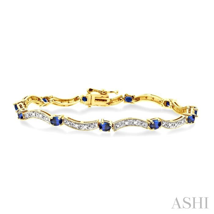 4x3 MM Oval Cut Sapphire and 1/10 Ctw Round Cut Diamond Bracelet in 14K Yellow Gold