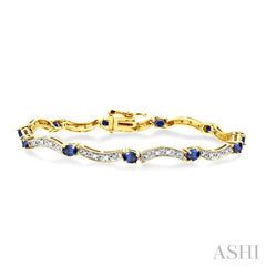 4x3 MM Oval Cut Sapphire and 1/10 Ctw Round Cut Diamond Bracelet in 14K Yellow Gold