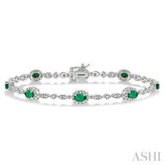 5x3 MM Oval Cut Emerald and 1/20 Ctw Round Cut Diamond Bracelet in 10K White Gold