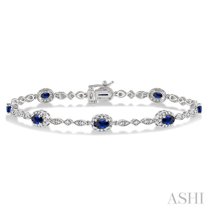 5x3 MM Oval Cut Sapphire and 1/20 Ctw Round Cut Diamond Bracelet in 10K White Gold