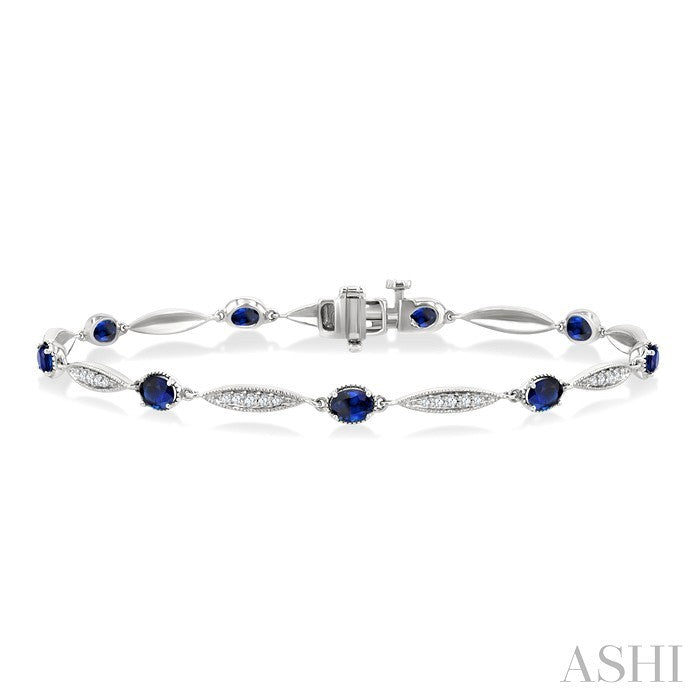 4X3 MM Oval Cut Sapphire and 1/4 Ctw Round Cut Diamond Precious Bracelet in 10K White Gold