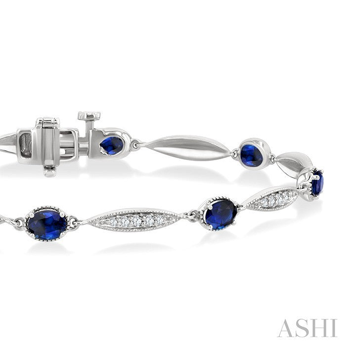 4X3 MM Oval Cut Sapphire and 1/4 Ctw Round Cut Diamond Precious Bracelet in 10K White Gold