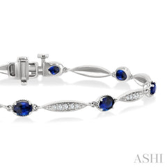 4X3 MM Oval Cut Sapphire and 1/4 Ctw Round Cut Diamond Precious Bracelet in 10K White Gold