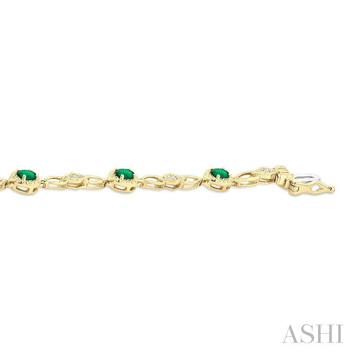 1/20 Ctw Oval Cut 4X3MM Emerald and Round Cut Diamond Precious Fashion Bracelet in 10K Yellow Gold
