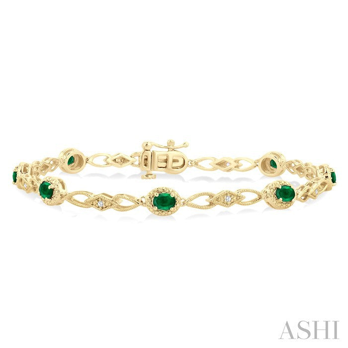 1/20 Ctw Oval Cut 4X3MM Emerald and Round Cut Diamond Precious Fashion Bracelet in 10K Yellow Gold