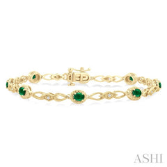 1/20 Ctw Oval Cut 4X3MM Emerald and Round Cut Diamond Precious Fashion Bracelet in 10K Yellow Gold