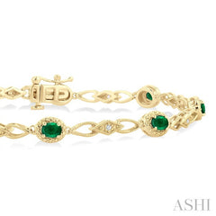 1/20 Ctw Oval Cut 4X3MM Emerald and Round Cut Diamond Precious Fashion Bracelet in 10K Yellow Gold