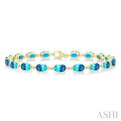 6X4 MM Oval Cut Blue Topaz and 1/6 Ctw Round Cut Diamond Semi-Precious Tennis Bracelet in 10K Yellow Gold