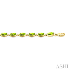 6X4 MM Oval Cut Peridot and 1/6 Ctw Round Cut Diamond Semi-Precious Tennis Bracelet in 10K Yellow Gold